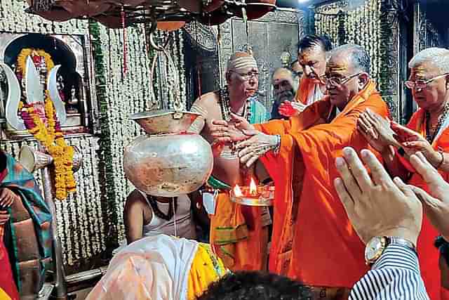 Nepal Prime Minister Pushpa Kamal Dahal, centre, offering prayers at the Mahakaleshwar Mandir in Ujjain last year.